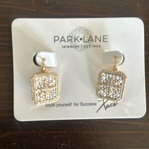 Gold and rhinestone earrings.
